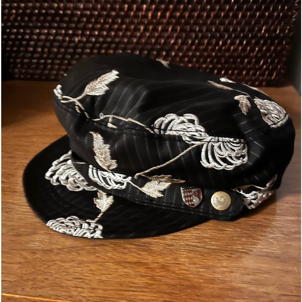 Satin finish Goorin newsboy cap with floral pattern